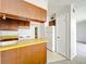 Kitchen featuring lots of storage, neutral countertops, and a view to the living room at 200 St Andrews Blvd # 911, Winter Park, FL 32792