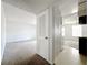 View into the living room of the home, showcasing lots of natural light and neutral color palette at 200 St Andrews Blvd # 911, Winter Park, FL 32792