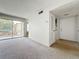 Bright living area with sliding doors to the balcony, offering natural light and outdoor views at 200 St Andrews Blvd # 911, Winter Park, FL 32792