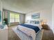 Calm main bedroom featuring a plush bed with an ocean view at 200 St Andrews Blvd # 911, Winter Park, FL 32792