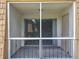 View of the screened porch that looks out towards the greenery of the complex at 200 St Andrews Blvd # 911, Winter Park, FL 32792