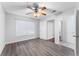 Bedroom features vinyl plank flooring, a ceiling fan, and two large closets at 2041 Dixie Belle Dr # 2041C, Orlando, FL 32812