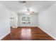 Well-lit bedroom featuring hardwood floors, ceiling fan and access to the closet at 2041 Dixie Belle Dr # 2041C, Orlando, FL 32812
