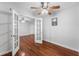 Bedroom with hardwood floors, ceiling fan, and french doors to another room at 2041 Dixie Belle Dr # 2041C, Orlando, FL 32812