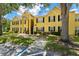 Exterior building view of property with well maintained lawn and easy access to unit entrances at 2041 Dixie Belle Dr # 2041C, Orlando, FL 32812