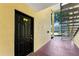 View of the entry door and access to the upper level of the condominium at 2041 Dixie Belle Dr # 2041C, Orlando, FL 32812