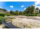 Well maintained community green space featuring mature trees, benches, sidewalks, and landscaping at 2041 Dixie Belle Dr # 2041C, Orlando, FL 32812