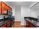 Beautiful kitchen with dark granite countertops, stainless steel microwave and gas stove at 2041 Dixie Belle Dr # 2041C, Orlando, FL 32812