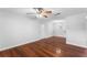 Open living room featuring hardwood floors, ceiling fan, and entry door at 2041 Dixie Belle Dr # 2041C, Orlando, FL 32812