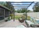 Well-maintained backyard with a pergola, providing a relaxing outdoor space with comfortable seating at 2042 Hayfield Way, Apopka, FL 32712