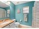 Well-lit bathroom features a granite countertop, stylish fixtures, and a coordinated color scheme at 2042 Hayfield Way, Apopka, FL 32712