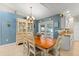 Cozy dining area with chandelier lighting and a view to the backyard at 2042 Hayfield Way, Apopka, FL 32712