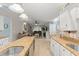 Kitchen showcasing an island with sink, and an open floor plan leading to the living area at 2042 Hayfield Way, Apopka, FL 32712