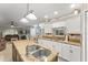Open-concept kitchen with island and view into the living room at 2042 Hayfield Way, Apopka, FL 32712