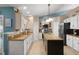 Kitchen with an island, stainless steel appliances, and abundant storage at 2042 Hayfield Way, Apopka, FL 32712