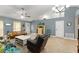 Living room showing tile flooring, neutral paint, high ceiling, and an airy, sunlit atmosphere at 2042 Hayfield Way, Apopka, FL 32712