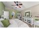 Spacious bedroom showcasing hardwood floors, neutral walls, and an ensuite bathroom through the archway at 2042 Hayfield Way, Apopka, FL 32712