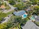 An aerial shot of the house with a swimming pool and well-maintained landscaping at 2220 Derbyshire Rd, Maitland, FL 32751