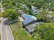 An aerial view displaying the property's backyard, pool, and surrounding community at 2220 Derbyshire Rd, Maitland, FL 32751