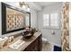 Bathroom showcasing unique vessel sink, granite counters, and window with shutters at 2220 Derbyshire Rd, Maitland, FL 32751