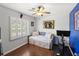 Bedroom featuring a daybed, ceiling fan, exercise bike and large window at 2220 Derbyshire Rd, Maitland, FL 32751