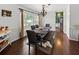 Comfortable dining area with a rustic table, bench seating, and lots of natural light at 2220 Derbyshire Rd, Maitland, FL 32751