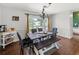 Bright dining room with stylish furnishings and view of the backyard at 2220 Derbyshire Rd, Maitland, FL 32751