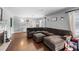 Living room with hardwood flooring, fireplace, and a comfortable seating area at 2220 Derbyshire Rd, Maitland, FL 32751