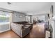 Comfortable living room featuring hardwood floors and a fireplace at 2220 Derbyshire Rd, Maitland, FL 32751