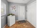 Mud room featuring closet, window, tiled floors and a deep freezer at 2220 Derbyshire Rd, Maitland, FL 32751