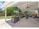View of the covered patio and fenced in back yard at 2220 Derbyshire Rd, Maitland, FL 32751