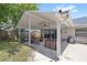 Relaxing covered patio area, perfect for outdoor dining and entertaining at 2220 Derbyshire Rd, Maitland, FL 32751