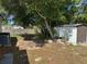 Spacious backyard featuring mature trees, a storage shed, and a wood fence at 2302 Greenwood St St, Deltona, FL 32738
