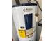 Close-up of a Whirlpool water heater with visible energy guide at 2302 Greenwood St St, Deltona, FL 32738
