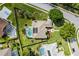 Aerial view of a home with a screened pool, solar panels and a large backyard at 245 Meadow Bay Ct, Lake Mary, FL 32746