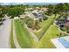 Aerial view of a home with a large lot, screened pool and beautiful landscaping at 245 Meadow Bay Ct, Lake Mary, FL 32746