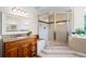 Bathroom with glass shower, soaking tub, granite vanity and lots of light at 245 Meadow Bay Ct, Lake Mary, FL 32746
