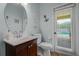 Cozy bathroom with a small sink and toilet and a pool view at 245 Meadow Bay Ct, Lake Mary, FL 32746