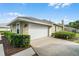 Attached two-car garage offers convenient parking and extra storage space, enhancing the home's functionality at 245 Meadow Bay Ct, Lake Mary, FL 32746