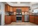 Beautiful kitchen featuring stainless steel appliances, tile backsplash, and granite countertops at 245 Meadow Bay Ct, Lake Mary, FL 32746