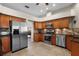 Bright kitchen featuring stainless appliances, stylish backsplash, and tile floor at 245 Meadow Bay Ct, Lake Mary, FL 32746