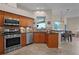 Charming kitchen with stainless appliances and granite countertops, offering great views of the backyard at 245 Meadow Bay Ct, Lake Mary, FL 32746