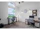 Bright home office featuring a large window, neutral walls, ceiling fan, and two desks with ergonomic chairs at 245 Meadow Bay Ct, Lake Mary, FL 32746