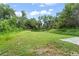 Spacious backyard featuring lush greenery and ample space for outdoor activities at 247 Toms Rd, Debary, FL 32713