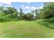 Spacious backyard featuring lush greenery and ample space for outdoor activities at 247 Toms Rd, Debary, FL 32713