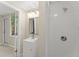 Updated bathroom featuring a vanity with mirror and glass-enclosed white tile shower at 247 Toms Rd, Debary, FL 32713