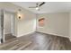 Bedroom featuring wood floors, neutral walls, ceiling fan, and natural light at 247 Toms Rd, Debary, FL 32713