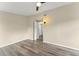 Bedroom featuring wood floors, neutral walls, ceiling fan, and natural light at 247 Toms Rd, Debary, FL 32713