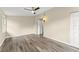 Bedroom featuring wood floors, neutral walls, ceiling fan, and natural light at 247 Toms Rd, Debary, FL 32713