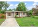 Charming single-story home features a well-manicured lawn, a concrete driveway, and decorative shutters at 247 Toms Rd, Debary, FL 32713